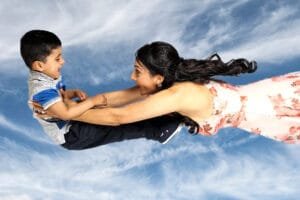 Mother and child flying through the air photoshoot