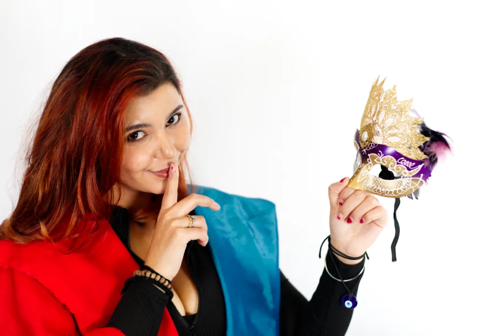 Harlequin Lady holding a masquerade mask