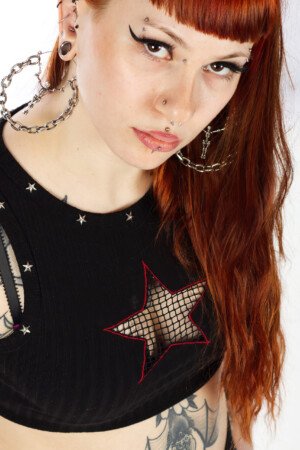 Actor photo shoot of young lady wearing black and sporting a tattoo