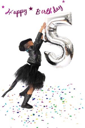 a girl in a tutu and a black jacket holding a silver balloon