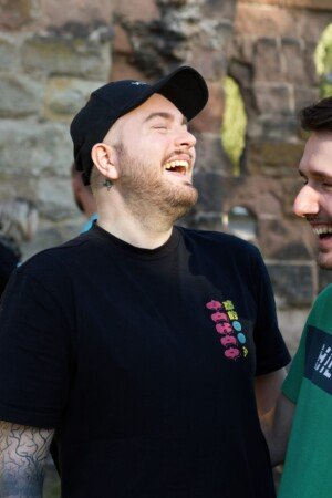 Couple of lads laughing for a photoshoot