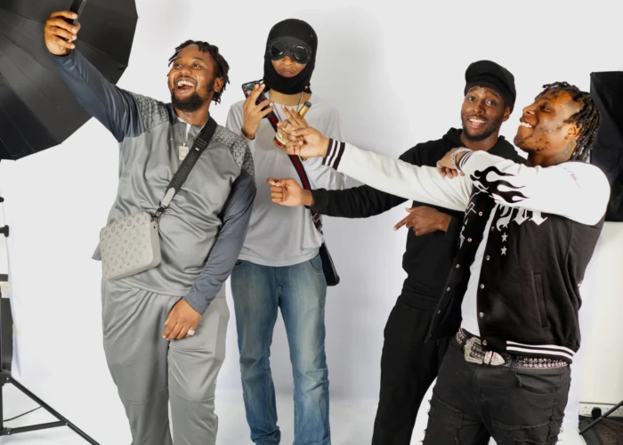 Four lads taking selfies at a photo studio